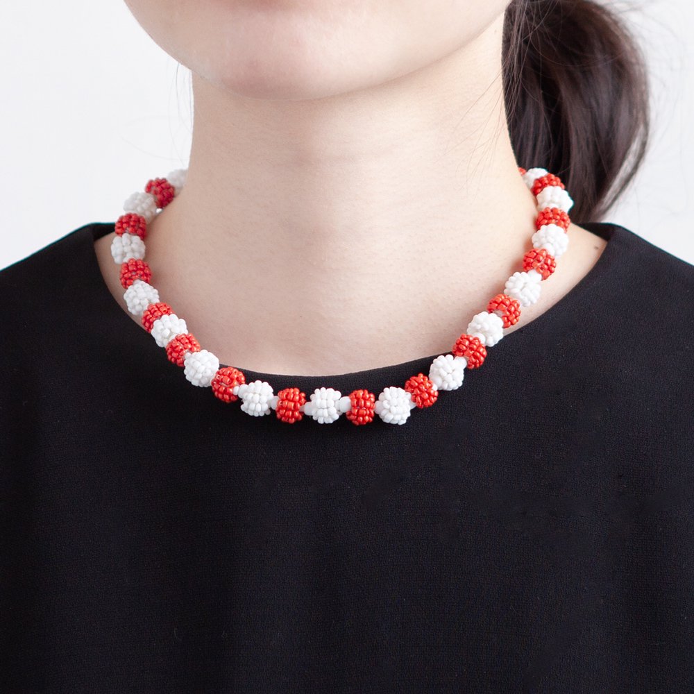 red seed necklace